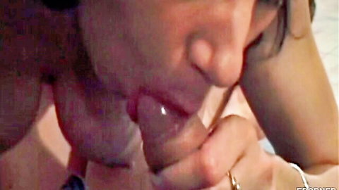 Close-up of woman giving deep blowjob, lips around thick cock