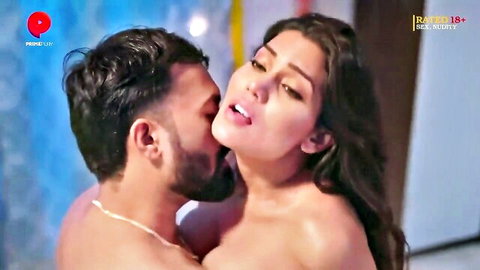 Indian couple passionate neck kiss, woman topless in erotic scene