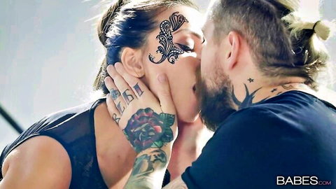 Alyssia Kent in passionate tattooed kiss with lover in sheer lingerie