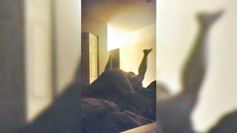 Amateur couple in legs-up missionary position, intense bedroom sex