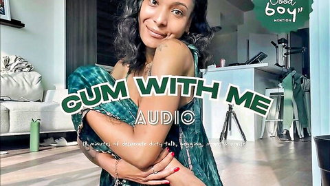 Curvy mixed woman in green dress smiles seductively in erotic audio porn invite