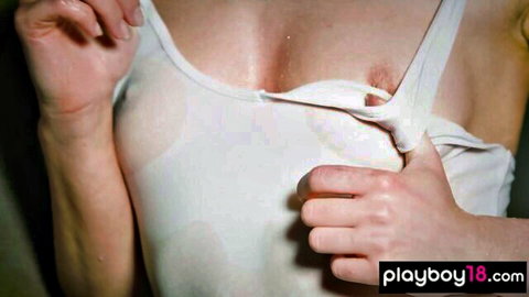 Petite blonde with big tits pulls down wet tank top exposing hard pink nipples in erotic solo tease