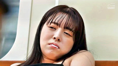 Pouting Asian woman in black tank top, JAV solo tease