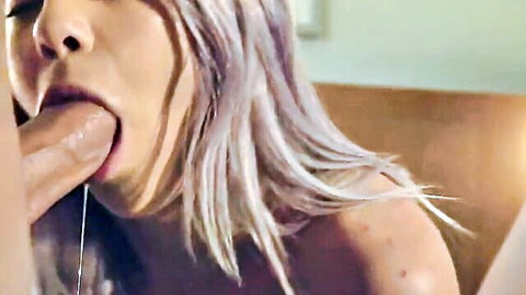 Blonde Asian babe deepthroats thick veiny cock with saliva dripping from her open mouth.