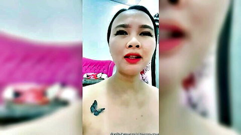 Indonesian model Mona teasing with butterfly tattoo on chest