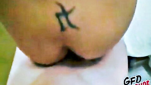 Close-up of tattooed curvy woman's big ass bent over in amateur oral video