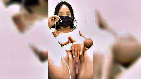 Indonesian big tits babe pulls down mask and spreads wet shaved pussy solo