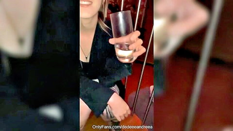 OnlyFans babe at party holding cum-filled glass after blowjob