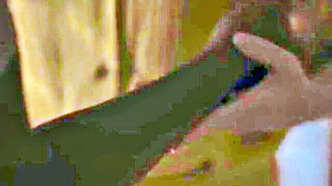 Elizabeth Olsen gripping man's arm in intimate scene