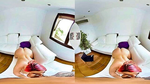 Curvy redhead with big ass lying nude face down on white couch showing bare cheeks in VR room