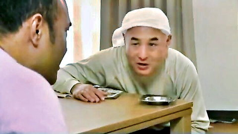 Turbaned Indian husband in tense game betting his wife at home table