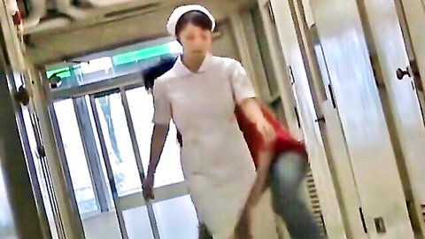 Young Japanese nurse in white uniform walking hospital hallway, resisting sharking