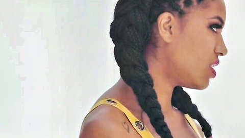 Tina Fire ebony milf with braids in sexy yellow top side profile