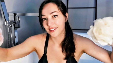 Orenda ASMR girlfriend in black swimsuit getting wet with loofah in shower