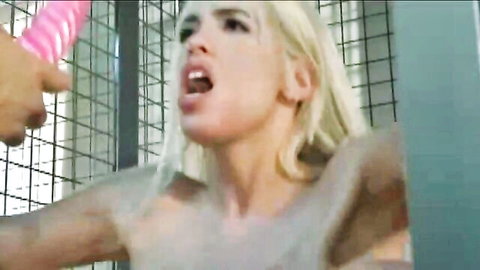 Blonde woman in cage toyed with pink dildo, messy body play