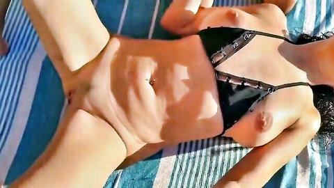 Asian wife topless on beach, legs spread exposing shaved pussy and small tits
