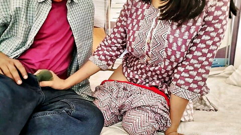 Curvy South Asian woman in salwar spreads legs as man holds green fruit near her pussy