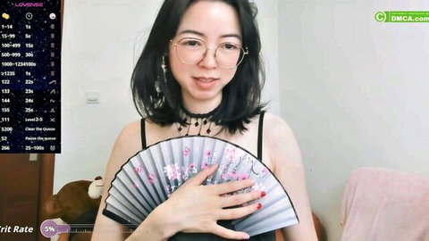 Luckrose Asian camgirl in black camisole and glasses, holding fan teasingly