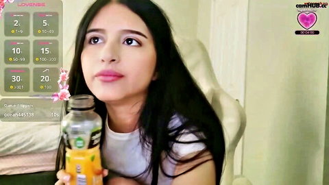 Cute Asian webcam solo girl sipping orange drink on Chaturbate live cam