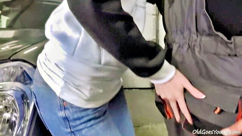 Mechanic babe gropes customer's bulge in garage tease