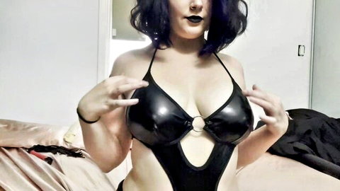 Goth mommy in black latex lingerie teases with big tits for JOI