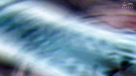 Blurry abstract wavy patterns in blue and pink tones from intense adult video