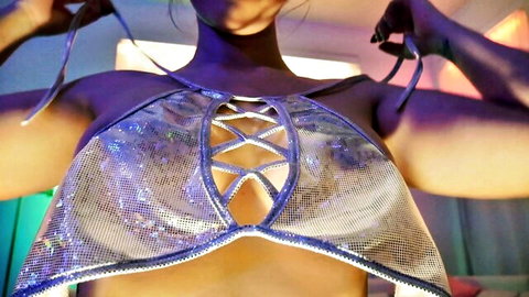 Ashley Alban in shiny rave tease top, exposing curves and cleavage
