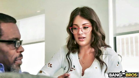Maddy May in glasses chats seductively with black stud in BangBros naughty scene