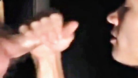 Asian woman slurping cock at gloryhole arcade