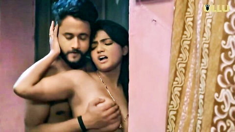 Stunning Indian beauty in passionate topless embrace with muscular man