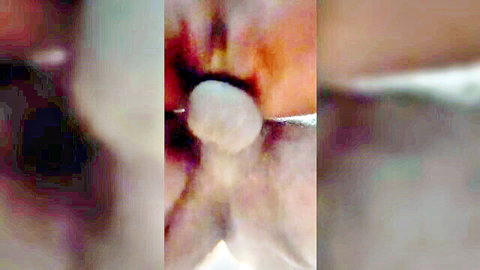 Blurry close-up of oral cumshot in mouth, explicit adult action