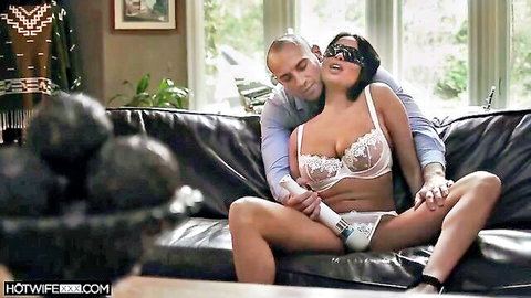 Anissa blindfolded in white lace lingerie embraced by lover