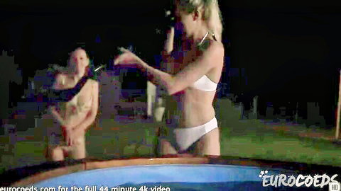 Two best friends in white lingerie teasing by the hot tub