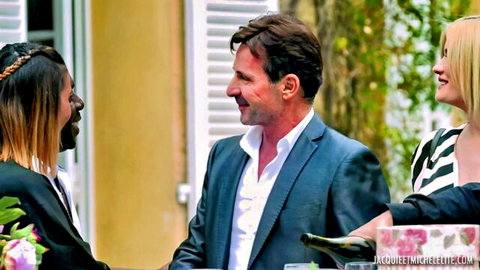 Candie Luciani as bride in elegant outdoor chat with suited man and blonde woman