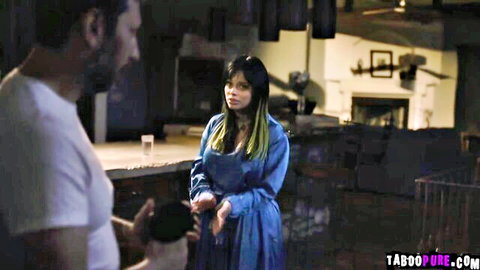 Bearded man gestures to curvy Asian woman in blue dress at kitchen counter taboo encounter