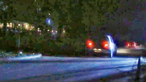 Nighttime street scene with white van in Italian power games video