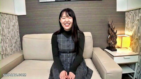 Smiling Japanese woman in gray checkered pinafore dress, first time with black man