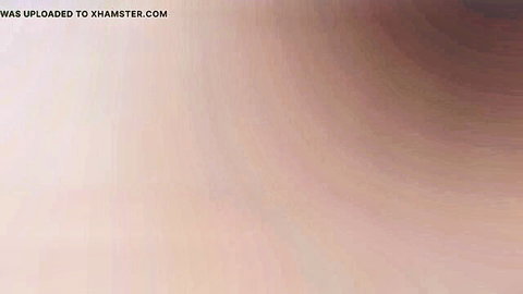 Blurry xHamster upload watermark overlay on empty pink gradient background