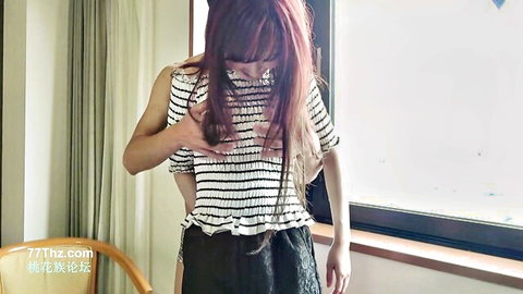 Japanese amateur woman lifting striped blouse to flash breasts