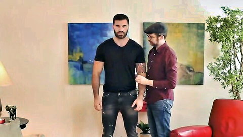 Muscular bearded man Daniel in intimate pose with slim guy, sharing wine