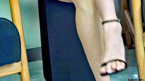 Didi's bare legs and feet in sexy black high heels