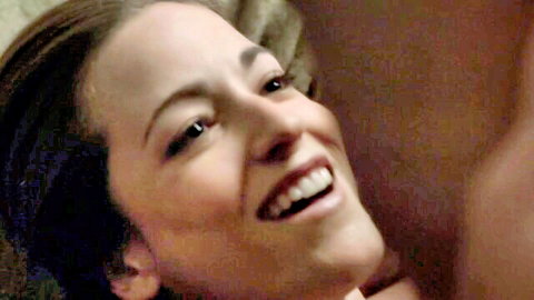 Carolina Ravassa smiling seductively in bed from The Affair
