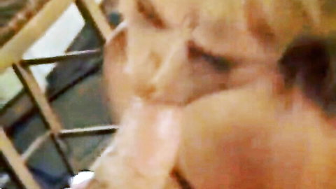 Blonde MILF with huge exposed tits leans in to suck thick veiny cock