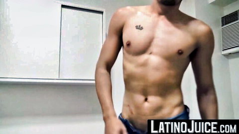Muscular Latino stud with chest tattoo pulls down jeans teasing his bulge