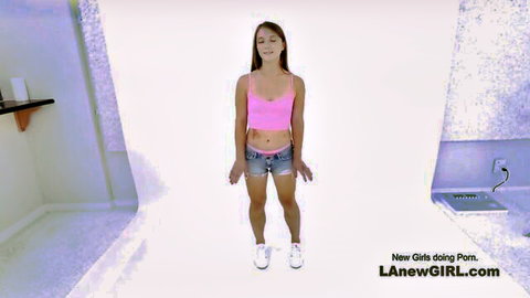 Petite brunette teen in tight pink tank top and tiny denim shorts poses for amateur porn casting audition