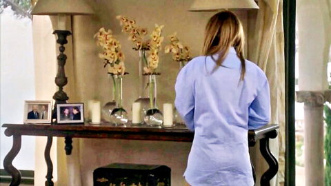 Bottomless blonde in light blue shirt exposes bare ass from behind at elegant table