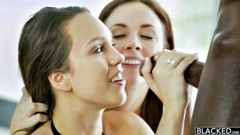 Two smiling brunettes sharing a massive BBC in hot interracial threesome