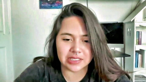 Yungtorii Chaturbate camgirl with long brown hair, lip piercing, pouting expression