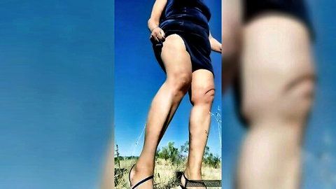 Amateur woman hikes up short black dress outdoors exposing shaved pussy and ass cheeks from behind