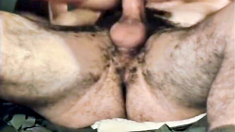 Closeup of hairy man's thick erect cock and heavy balls spread wide open